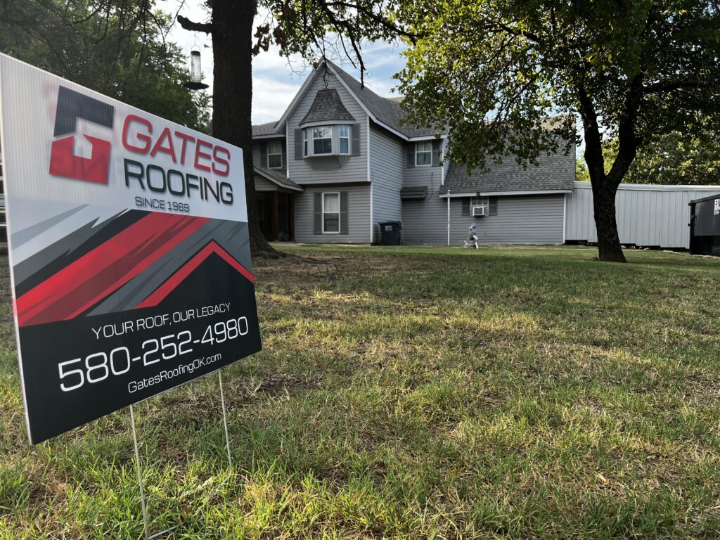 Gates Roofing sign in front of a residential home